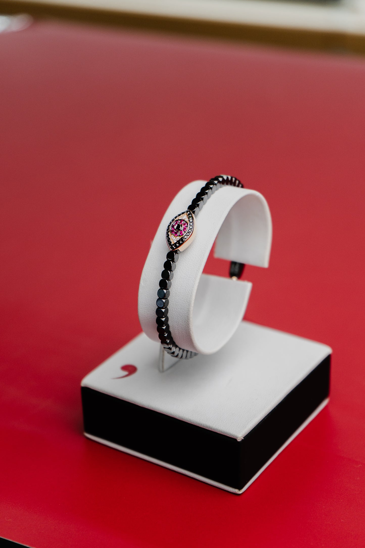 Bracciale Roberto Demeglio in ceramica nera lucida simbolo occhio in rubini, diamanti neri e bianchi su oro rosa