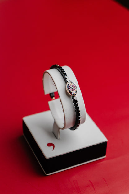 Bracciale Roberto Demeglio in ceramica nera lucida simbolo occhio in rubini, diamanti neri e bianchi su oro rosa