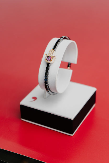 Bracciale Roberto Demeglio in ceramica nera satinata e simbolo mano in rubini, diamanti neri, bianchi e brown su oro rosa